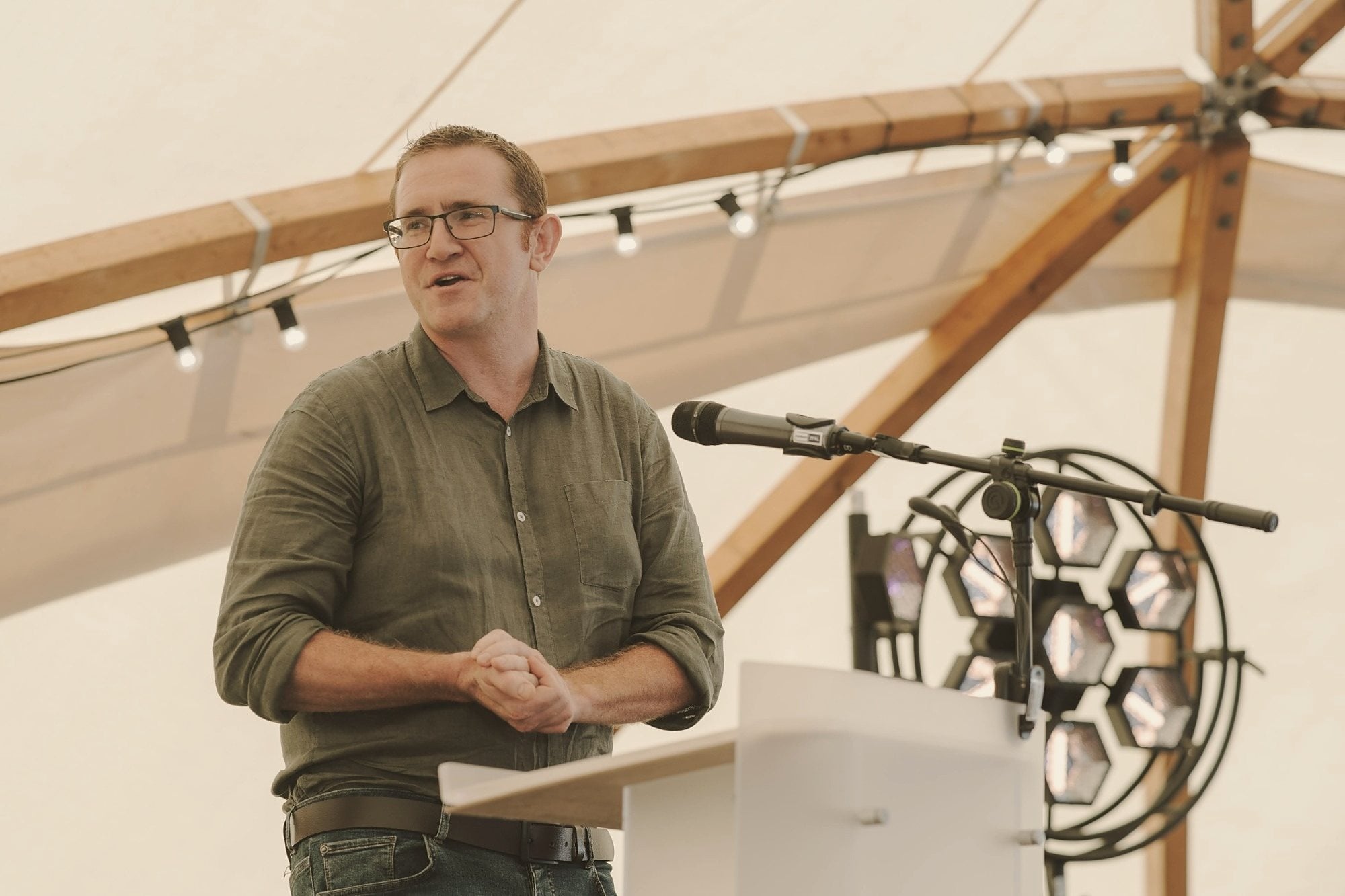 Ben Hart speaking at a lectern
